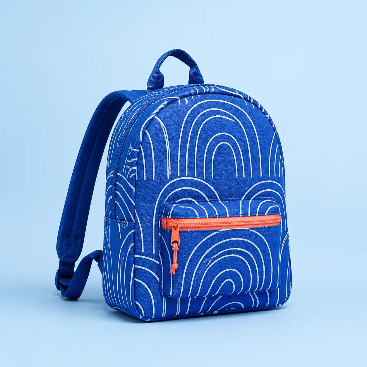 Cobalt compact backpack with white curved line pattern and coral zip accent