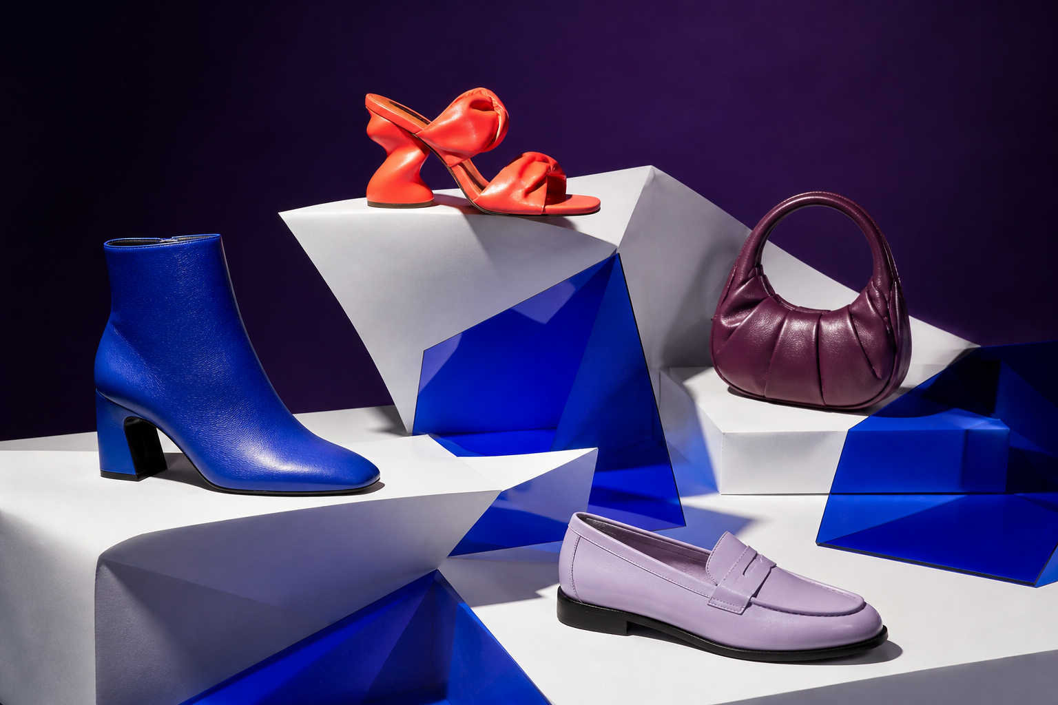 Cobalt boot, coral sandal, aubergine bag and lilac loafer on graphic platforms